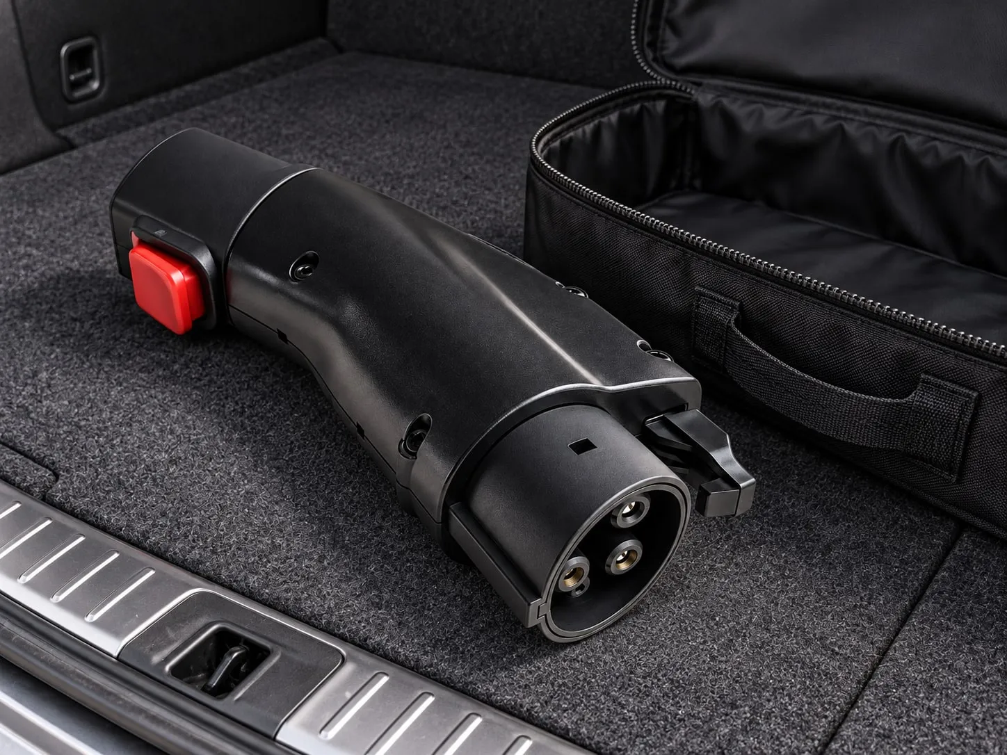 EV charging adapter in a car boot